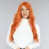 Lange Oranje Krullende Pruik Met Rechte Pony -Party Outfitters lange oranje krullende pruik met rechte pony